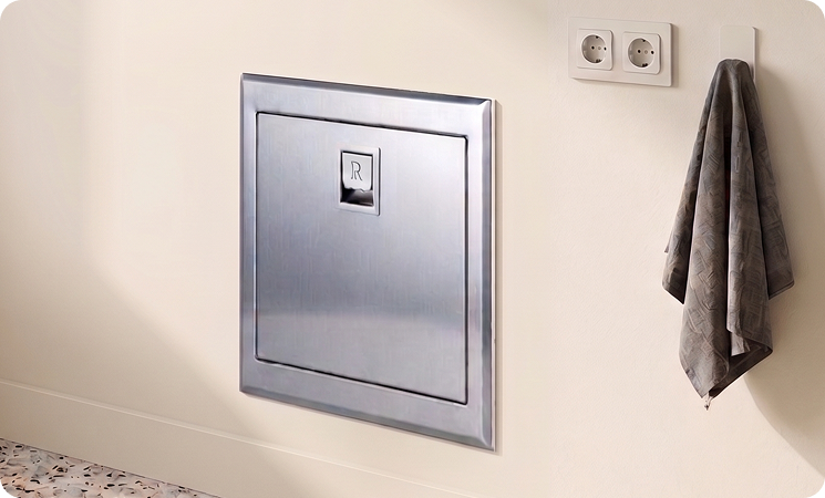 Chute installed beside hanging towel